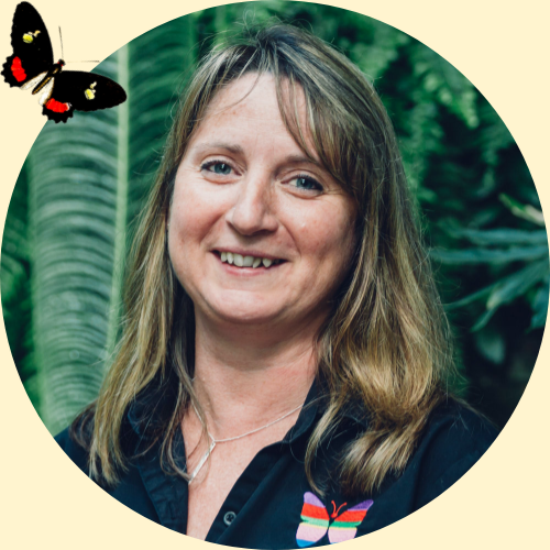 A photo of general manager Ronalea posing in the butterfly gardens